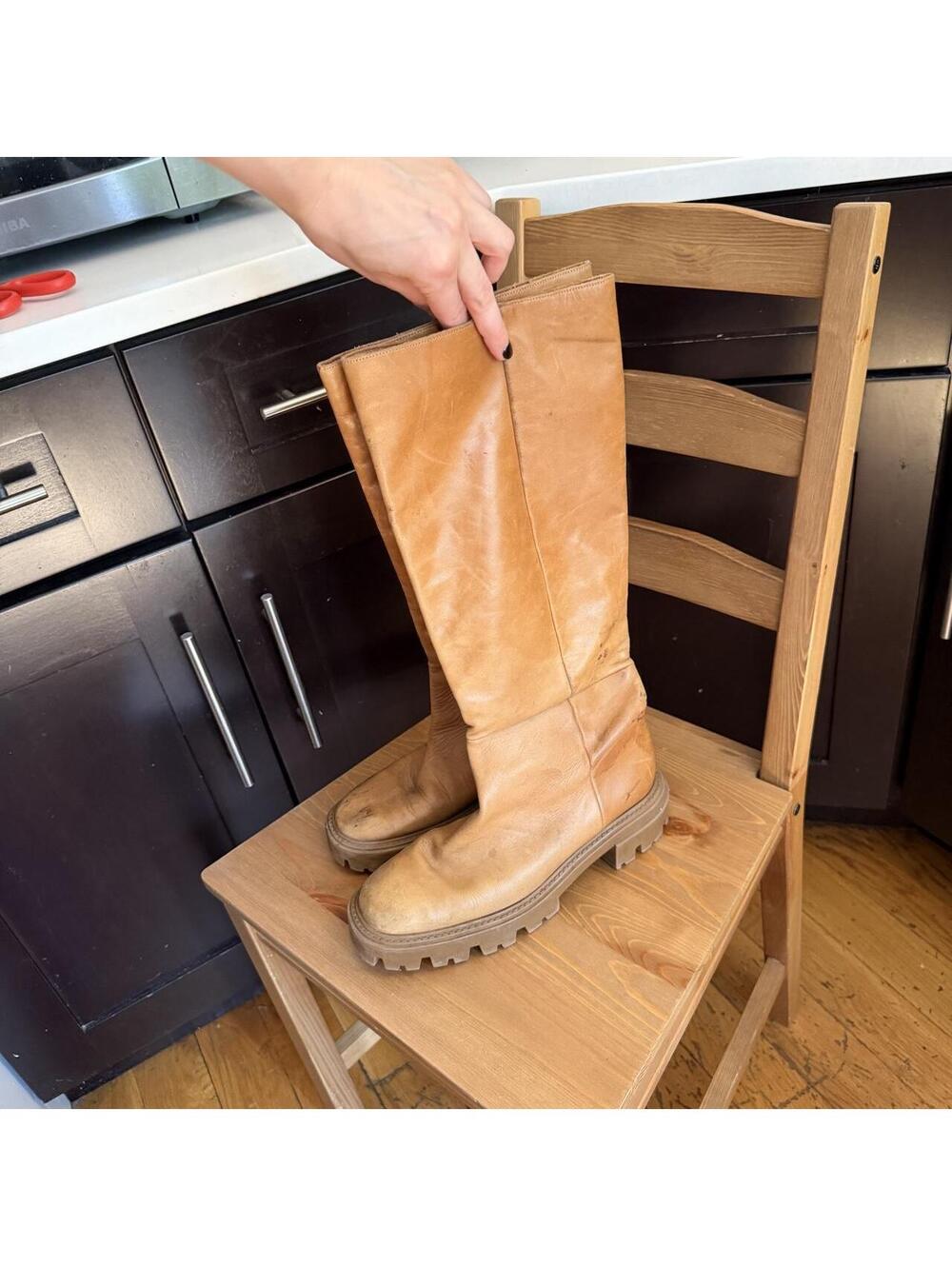 Tan leather knee-high boots with chunky sole